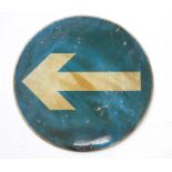 A circular aluminium directional arrow road sign, 60cms diameter.