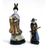 An early 20th century Chinese cloisonne figure of a robed woman with simulated ivory face and hands,