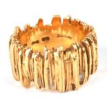 An 18ct gold modern design textured bark ring, approx UK size 'K', 13.7g.