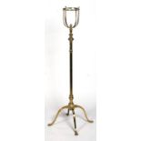 A heavy 19th century brass oil lamp stand on a quatrefoil base, 131cms high