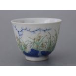 A Chinese Republic style tea bowl decorated with flowers and calligraphy, six character blue mark to