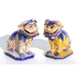 A pair of French pottery figures (possibly Rouen) in the form of temple lions. 17cm high