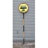 A lollypop persons stop sign, 193cms high.