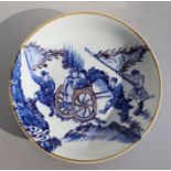 A Chinese blue, white and red shallow bowl depicting figures in a cart, six character blue mark to