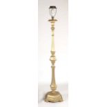 A gilt painted wooden standard lamp.