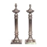 A pair of Corinthian column style silver plated table lamps on square bases, 53cms excluding