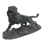 After Thomas Cartier (French 1879-1943) a large bronze study of a roaring male lion, on a