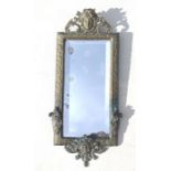 A Victorian brass framed bevel edged wall mirror with classical mask decoration, overall 22 by