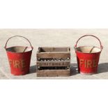 Two red painted galvanised fire buckets with wrought iron hangers; together with a Whitbread Brewery