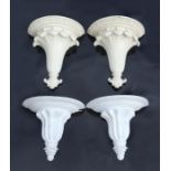 A pair of white painted moulded resin wall brackets, 37cms wide; together with another similar,