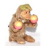 A vintage West German clockwork mechanical toy monkey, 19cms high.