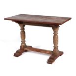 An oak refectory style table with planked top, on baluster turned supports joined by a stretcher,