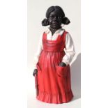 A figure of a black girl wearing a red dress and holding a skipping rope, 65cms high.