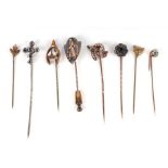 A group of Victorian and Edwardian stick pins to include fox head, horseshoe, crucifix and