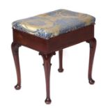 A mahogany piano stool on cabriole legs with lift-up upholstered seat, 47cms wide.