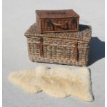 A large wicker laundry basket, 79cms wide; together with a Fortnum & Mason wicker picnic basket,