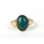 A 14ct gold ring set with an oval malachite cabochon, approx UK size 'Q', 3.5g.