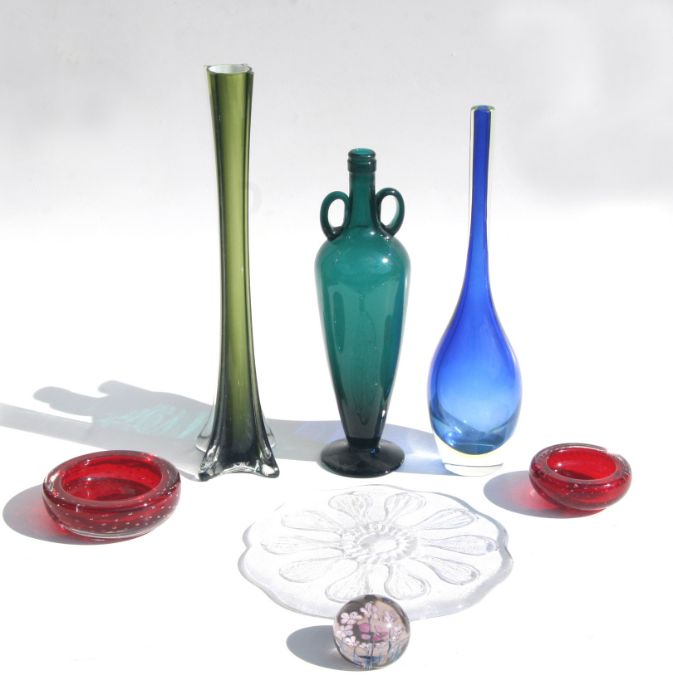 A collection of Studio glassware to include a green cased candlestick of cylindrical waisted form,