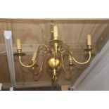 A Dutch style five-branch brass chandelier, 55cms wide.