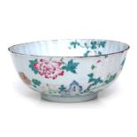 An 18th century Chinese famille rose footed bowl decorated flowers, 23cms diameter.Condition