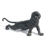 A large Japanese bronze study of a roaring tiger, four character mark to the underside, 47cms long.