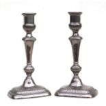 A pair of silver plated candlesticks, 40cms high.