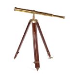 A reproduction three-draw brass telescope on stand, 98cms high.