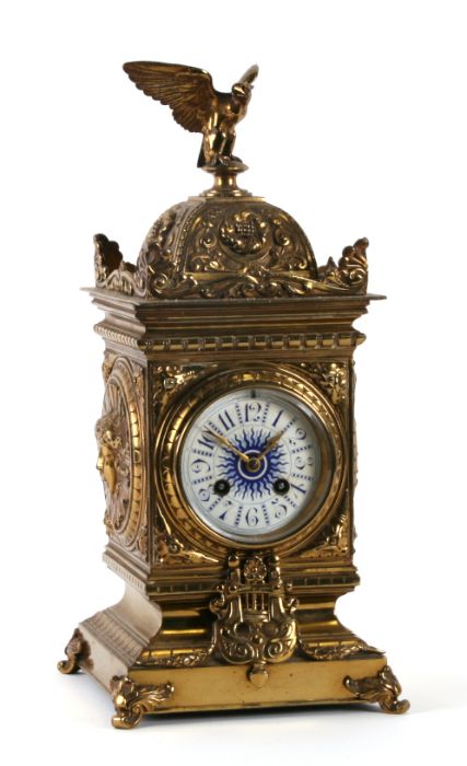 A 19th century mantle clock, the white enamel dial with Arabic numerals, the movement striking on