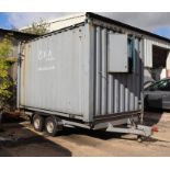 A 12.5ft twin-axle portable site office converted from a shipping container, the single window