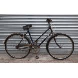 A vintage BSA ladies bicycle with Sturmey Archer three-speed gears, full mud guards and sprung