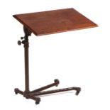 A Victorian Carter's of London cast iron adjustable reading table with tilt and height adjustment,