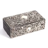 A Victorian leather jewellery box clad with silver repousse decoration, Chester 1896, 21cms wide.