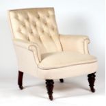 A 19th century button back tub armchair on turned mahogany front legs.
