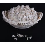 A 19th century Belleek two-handled basket profusely decorated with flowers (a/f), 24cms wide.
