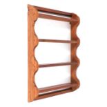A pitch pine open four-shelf wall hanging plate rack, 65cms wide.