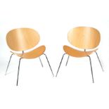 A pair of Italian design Arrmet Tamago chairs with ply formed back and seat, on chrome legs (2).