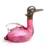 A novelty cranberry glass miniature claret jug modelled as a duck with silver plated mounts and
