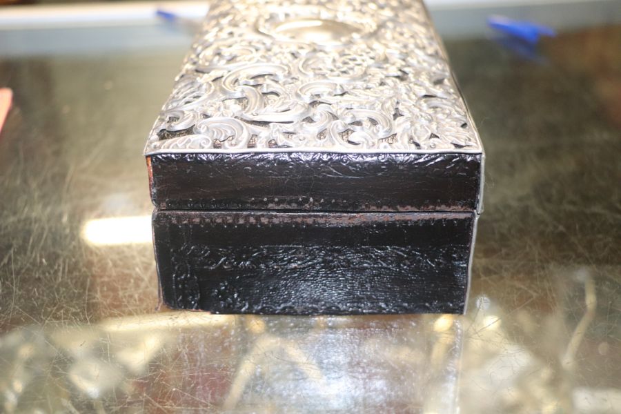 A Victorian leather jewellery box clad with silver repousse decoration, Chester 1896, 21cms wide. - Image 3 of 9