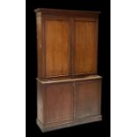 A 19th century mahogany Estate cupboard, the pair of panelled doors enclosing a sectioned interior
