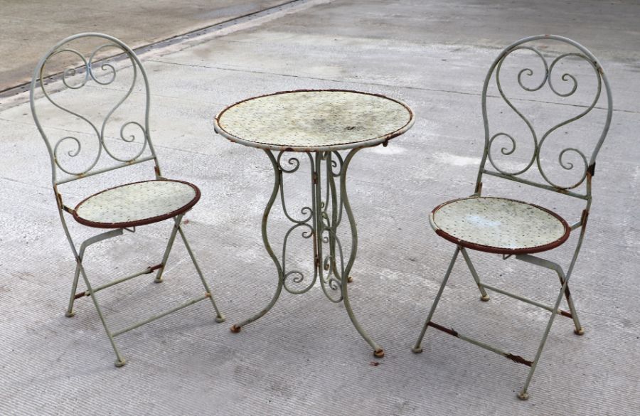 A French style wirework three-piece patio set comprising table and two folding chairs (3).