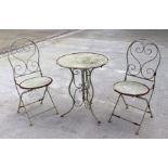 A French style wirework three-piece patio set comprising table and two folding chairs (3).
