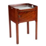 A Gorge III mahogany tray-top commode with single cupboard, on chamfered square legs, 51cms wide.