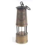 An Eccles Manchester Protector miner's safety lamp, 25cms high.