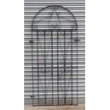 A wrought iron gate with arched top, 82cms wide.