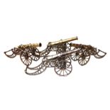 A large silver plated desk top cannon with 29cms barrel, overall length 44cms; together with three