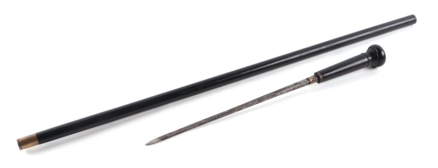 A late 19th century French ebonised sword stick with short stiletto blade, 83cms long.