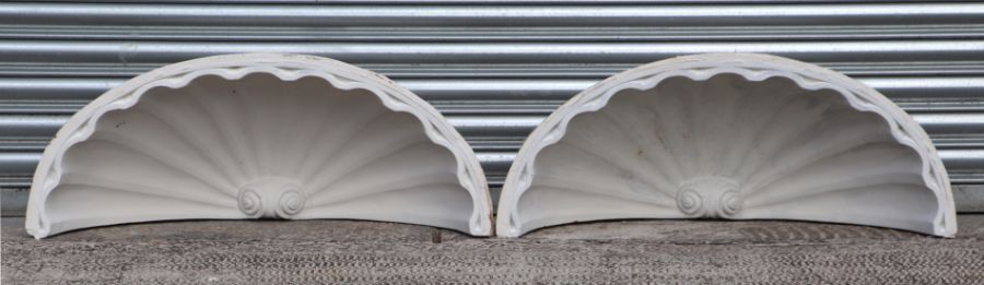 A pair of plaster niche or door caps, each 86cms wide (2).