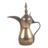 A Turkish / Islamic brass dallah coffee pot, 30cms high.Condition ReportThere is general wear, no