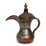 A Turkish / Islamic tinned copper dallah or coffee pot, 20cms high.Condition ReportThere is