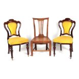 A pair of Victorian mahogany upholstered back and seat dining chairs on carved inverted baluster